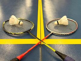 Racket and Shuttlecock with use sport or exercise on a black background. photo