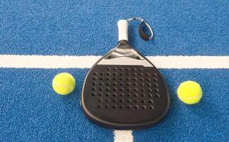 Paddle objects on blue turf photo