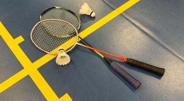 Racket and Shuttlecock with use sport or exercise on a black background. photo