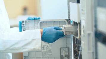 research in a biochemical laboratory using modern technologies. use a computer for scientific research video