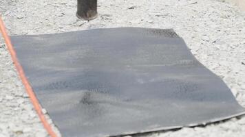 installation of protective waterproofing on the foundation and walls of the building. warmed by an open fire video