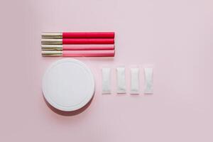 Multicolored cigarettes and snus pads on a paper background, the concept of a bad habit. photo