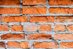 wall of the house of the old red brick. texture and background for designers photo