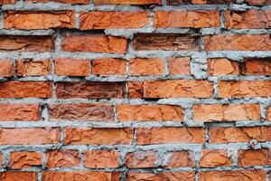 wall of the house of the old red brick. texture and background for designers photo
