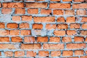 wall of the house of the old red brick. texture and background for designers photo