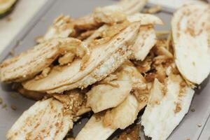 Eggplant cut without pulp on a white table before cooking photo