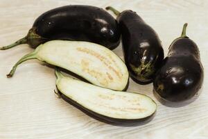 Eggplant cut without pulp on a white table before cooking photo