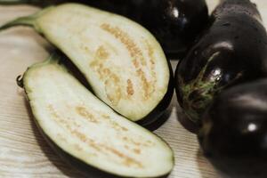 Eggplant cut without pulp on a white table before cooking photo