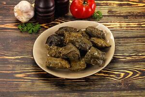 Stuffed dolma - meat in grape leaves photo