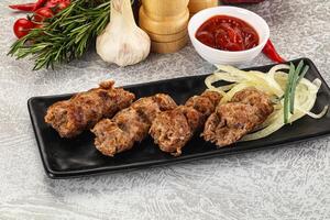 Beef kebab minced meat with onion photo
