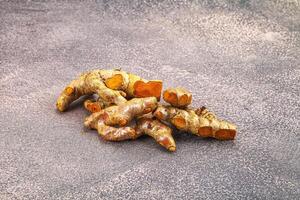 Fresh young Tumeric root heap photo