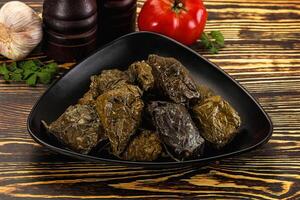 Stuffed dolma - meat in grape leaves photo