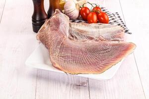 Raw uncooked stingray fish wing photo