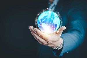 Man hands holding blue earth and global networking connection and data exchanges, global communication network concept photo