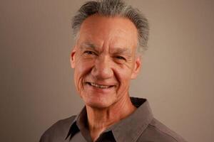 Close up Portrait of a Happy Mature Man Smiling photo