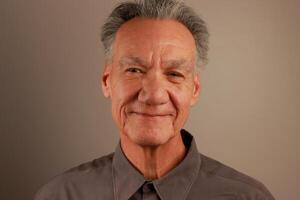 Close up Portrait of a Happy Mature Man Smiling photo