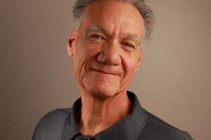 Close up Portrait of a Happy Mature Man Smiling photo