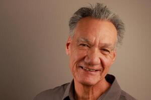 Close up Portrait of a Happy Mature Man Smiling photo