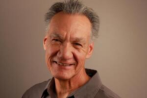 Close up Portrait of a Happy Mature Man Smiling photo