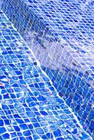 macro photography of the water surface in the pool highlighting textures photo