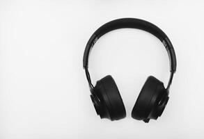 Black headphones on a white background. Large black headphones. photo