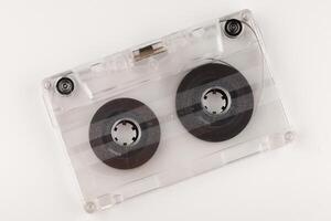 Old audio cassette on a white background close-up photo