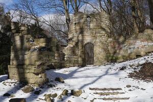 The ruins of the castle in Stryisky Park in Lviv in winter photo