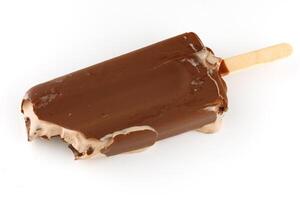 Chocolate ice cream on a stick bitten melts photo