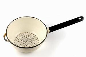 Old colander. Isolate on a white background. photo