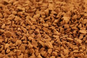 Instant coffee in granules close-up. Instant drink. photo