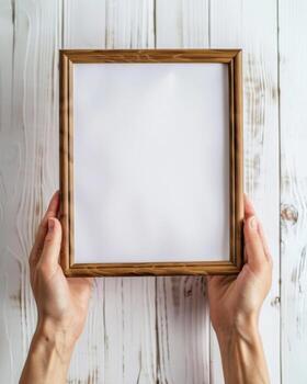 Hands Placing Blank Photo Frames on Wall for Mockup