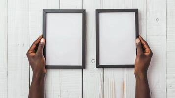 Hands Placing Blank Photo Frames on Wall for Mockup
