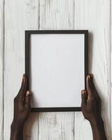 Hands Placing Blank Photo Frames on Wall for Mockup