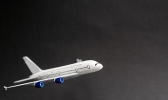 Model plane, airplane on dark background. photo