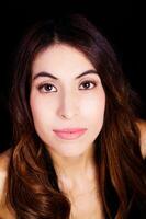 Bare Shoulder Portrait Hispanic Woman On Black Background photo