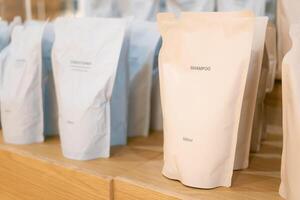 Refill packet. Zero waste. Reuse reduce recycle concept. refill liquid soap, shampoo and other products. Plastic packaging for refill pouch in store. photo