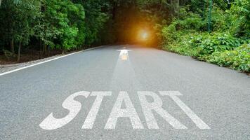 Starting line on asphalt road, Business startup idea, Copy space background, Path to success, Business competition concept, Setting business goals. photo