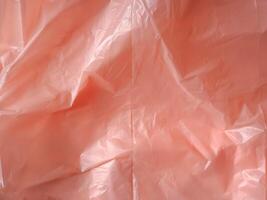 Old rose colored plastic bag texture for abstract background. photo