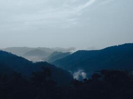 View on the mountain in the evening, close to night, slightly foggy. photo