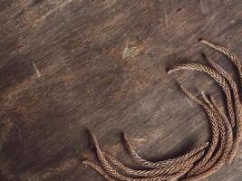 Pine leaves on old brown wood background, vintage style for copy space. photo