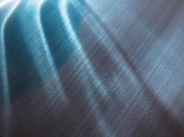 Light reflects minimal on foam in the dark. photo