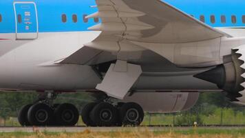 Close-up shot of the plane taxiing, view of the chassis and wing, engines video