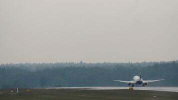 Rear view, plane acceleration and takeoff. Airliner flying away. Travel concept. Spotting video