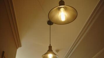 loft style lamps hanging on the ceiling, view from below video