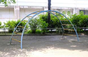 Blue joyful climbing frame for child and kids in Japan playground photo