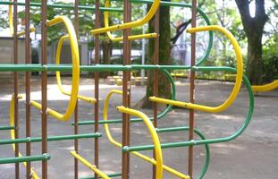 Yellow joyful climbing frame for child and kids in Japan playground photo