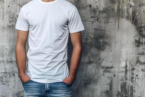 Young man wearing bella canvas white shirt mockup, at gray concrete, stone background. Design tshirt template, print presentation mock-up. photo