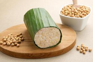 Raw Tempeh or Tempe, Indonesian traditional food, made from fermented soybeans. Usually fried for a side dish or for other cooking ingredients. photo