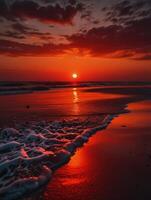 a red sunset over the ocean and beach photo