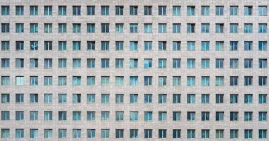Modern office building. Windows of a multi-storey skyscraper. Rows of identical windows. photo